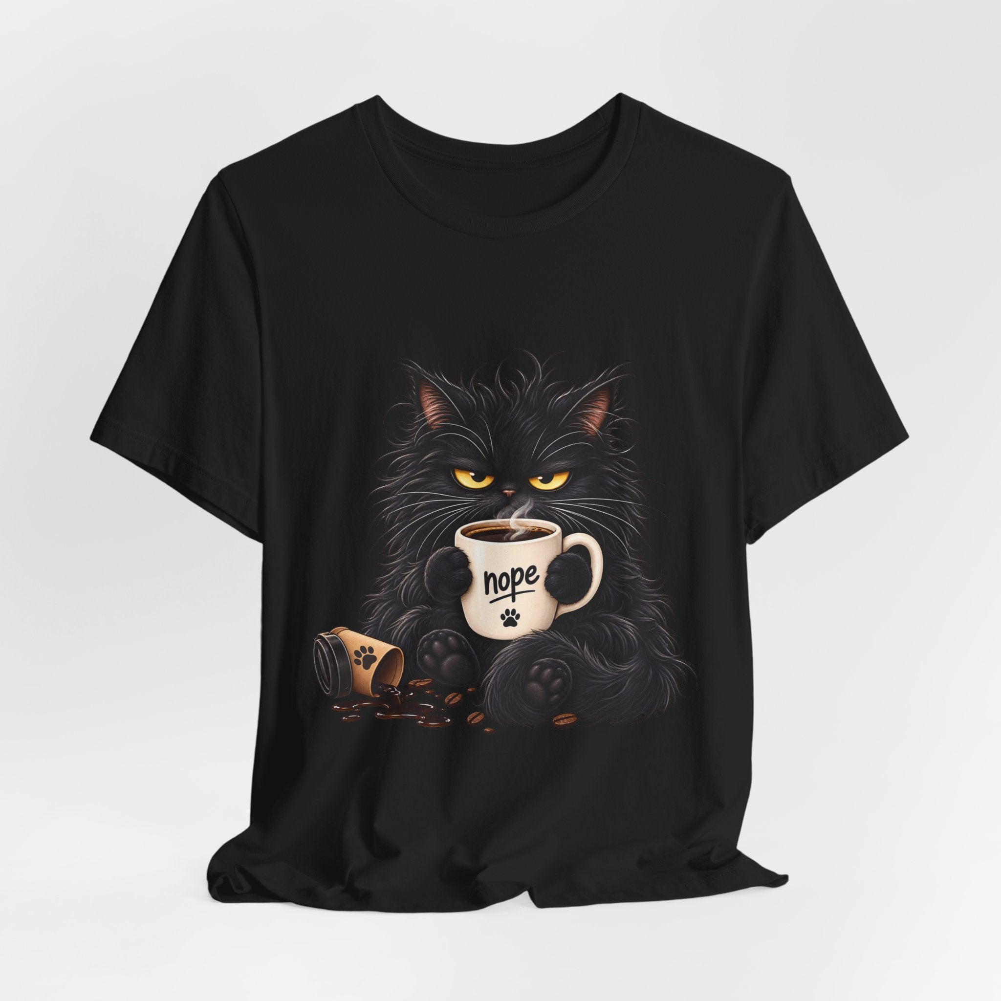 Nope Cat Coffee T‑Shirt — Grumpy Black Cat Holding 'Nope' Mug