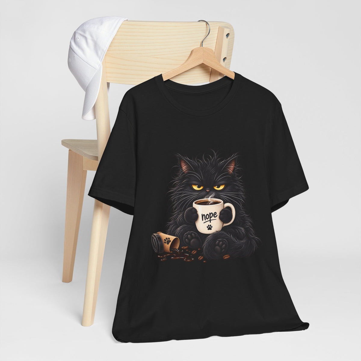 Nope Cat Coffee T‑Shirt — Grumpy Black Cat Holding 'Nope' Mug